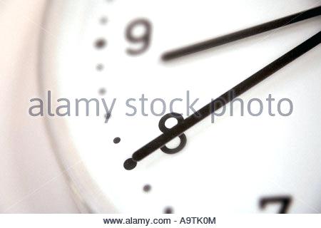 modern clock face modern clock face showing hands and the numbers eight and nine stock photo